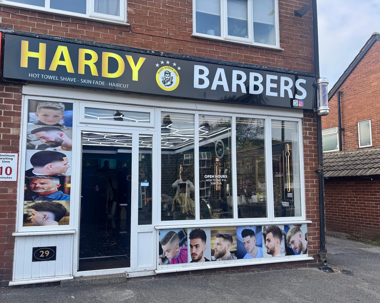 The black and yellow Hardy Barbers shopfront at number 29 Station Road